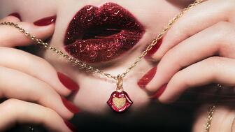 The new Pandora x Pat McGrath collection, featuring lipstick charms and lip-shaped signet rings, will debut on Oct. 8. Pandora x Pat McGrath campaign image