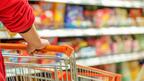 The Conference Board’s monthly Consumer Confidence Index slipped in July as worries persisted about rising prices. Hands pushing shopping cart