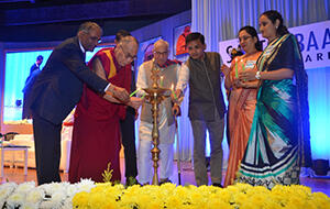 Pictured here is the lighting of the lamp during the ceremony in which SRK awarded the Dalai Lama with its Santokbaa Award. 010615_SRK-Article.jpg