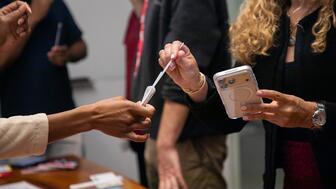 Woman holding testing swab
