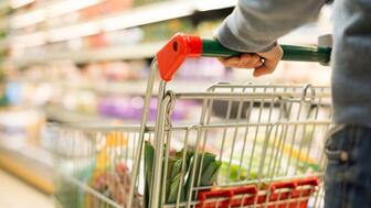 The Conference Board’s monthly Consumer Confidence Index fell in August as respondents reported feeling concerned about rising prices, the job market, and their income. Hand pushing a shopping cart