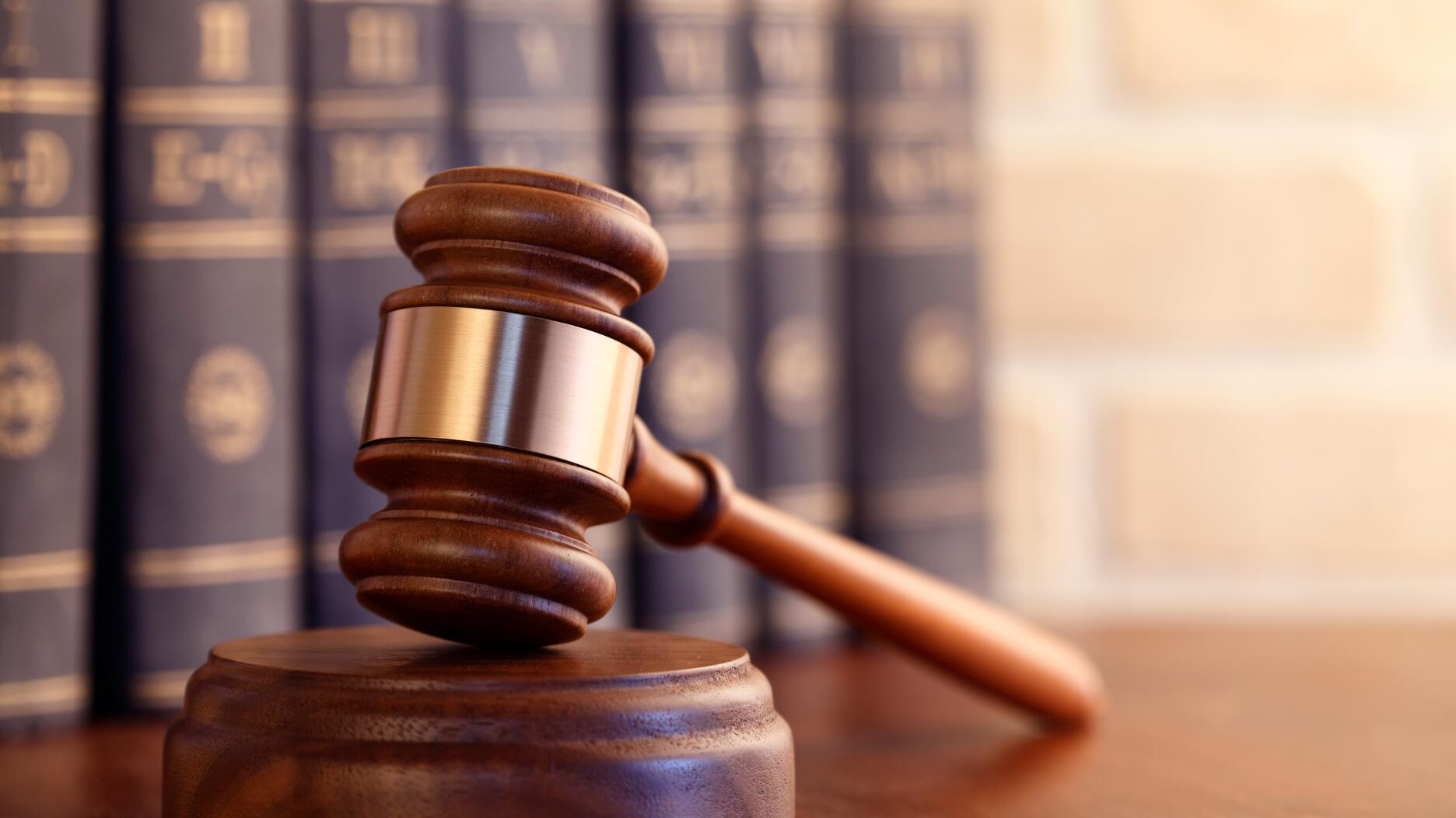 Stock image of a gavel and law books 