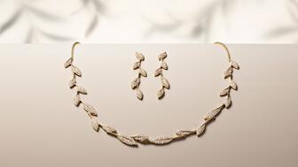 Brilliant Earth Jane Goodall olive branch necklace and earrings