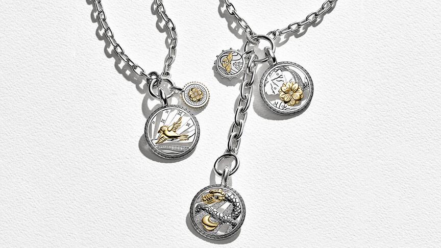 John Hardy’s “Modern Talisman” capsule collection of pendants features five motifs across two sizes: the Bali starling, a lotus, a butterfly, the naga Balinese dragon, and (not pictured) a seashell. John Hardy Modern Talisman Collection Campaign Imagery
