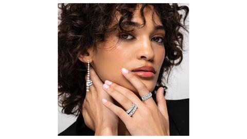 Woman wearing Charles & Colvard lab grown diamond jewelry