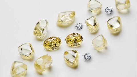 A mix of white and yellow rough diamonds from the Ekati Diamond Mine in Canada’s Northwest Territories. The owner of the mine, Burgundy Diamond Mines Ltd., has filed for insolvency protection as it attempts to restructure and cut costs to keep the financially struggling mine open. (Photo courtesy of Burgundy Diamond Mines Ltd.) White and yellow rough diamonds from the Ekati Diamond Mine
