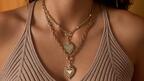 The “Sacred Heart” charm necklaces from the namesake collection are made in 18-karat yellow gold and are accented by, top, 0.95 carats of diamond pavé ($24,800) or, bottom, 0.50 carats of diamond pavé ($23,800). Lionheart Sacred Heart Charm Necklace