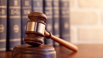 Stock image of a gavel and law books 
