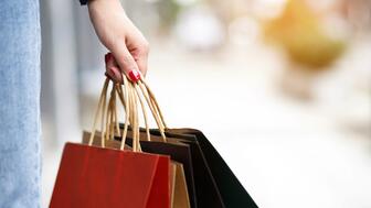 Consumer confidence essentially held steady this month, according to The Conference Board’s Consumer Confidence Index. It stood at 94.6, only a one-point drop from September’s upwardly revised 95.6. The baseline for the index, which was established in 1985, is 100.  Stock image of person holding shopping bags