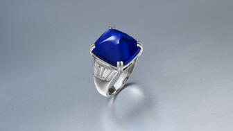A platinum ring featuring a 16.58-carat Kashmir cabochon sapphire with tapered baguette-cut diamonds sold for $1 million at Christie’s online jewelry sale. Its pre-sale estimate was $800,000 to $1.2 million. Christies Kashmir sapphire ring