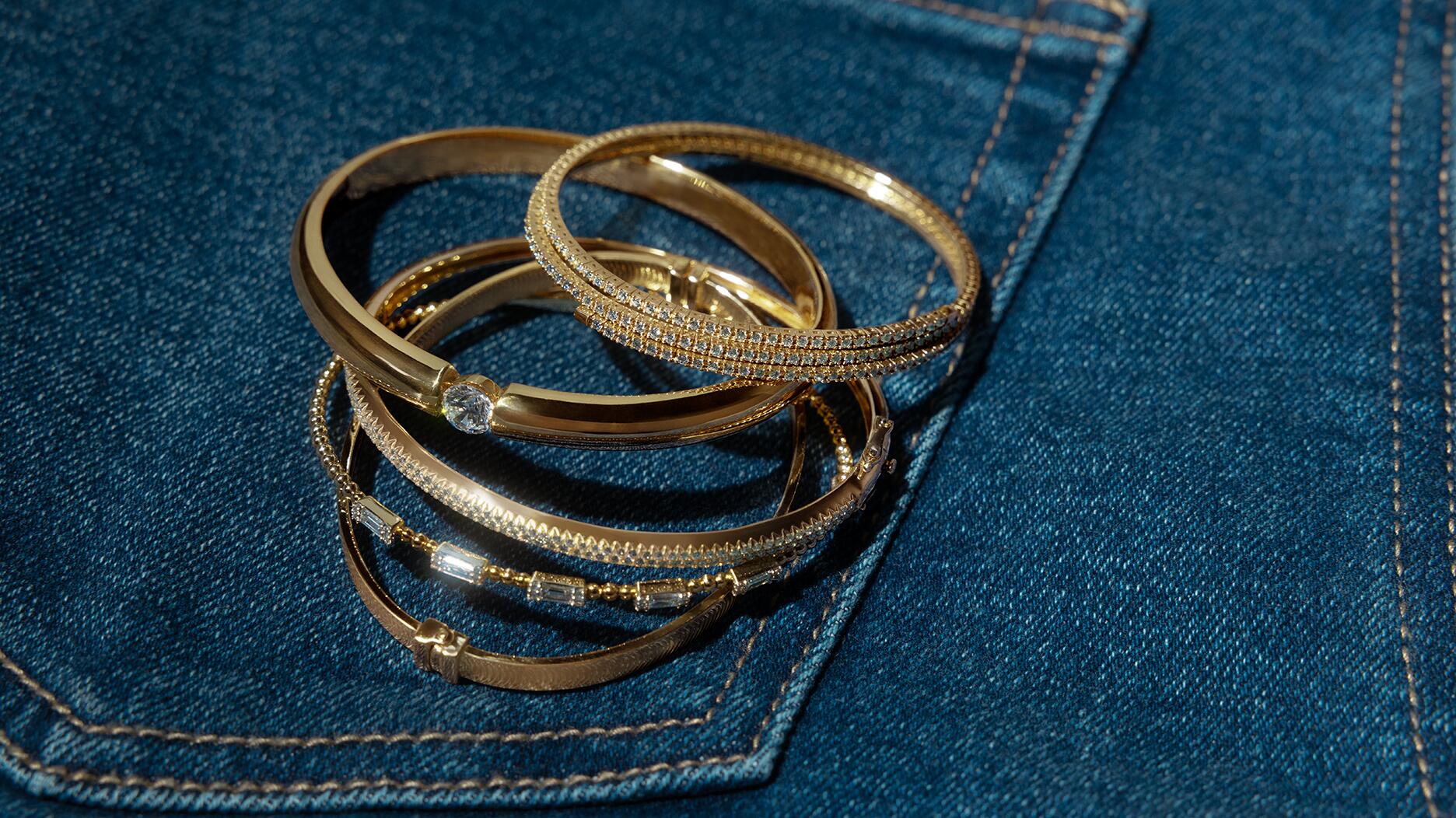 A selection of gold bracelets and bangles from Signet Jewelers-owned banner Zales. Signet Jewelers placed at No. 69 on the National Retail Federation’s Top 100 Retailers list. Gold bracelets and bangles