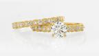 This bridal set is made in 14-karat yellow gold accented with millgrain edges. The wedding band, top, uses 0.25 carats of round lab-grown diamonds ($915) while the engagement ring, bottom, centers a round 1-carat lab-grown diamond with 0.22 carats of lab-grown diamonds on the band ($1,382). Rio Grande Millgrain Wedding band and Round Diamond Engagement Ring