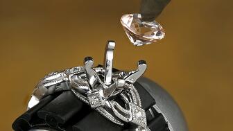 Rio Grande, a supplier of jewelry-making equipment, tools, and other materials, is offering more tools and services to help jewelers fulfill custom design requests. Jeweler setting a diamond into a ring