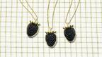 The “Blackberry” pendants are made in 18-karat yellow gold and use carved black onyx for the fruit and emeralds for the sepal ($8,950). Brent Neale x Blackberry Farm Blackberry Pendants