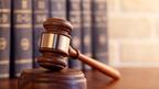 Stock image of a gavel and law books 