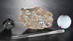 The 2,488-carat “Motswedi” diamond pictured next to a loupe, tweezers, and a golf ball for scale. Lucara Diamond Corp. recovered the diamond from the Karowe mine in Botswana in August 2024 and sold it during the second quarter of 2026. (Photo courtesy of Lucara Diamond Corp.) Picture of 2,488 carat rough diamond next to tweezers, a golf ball, and a loupe