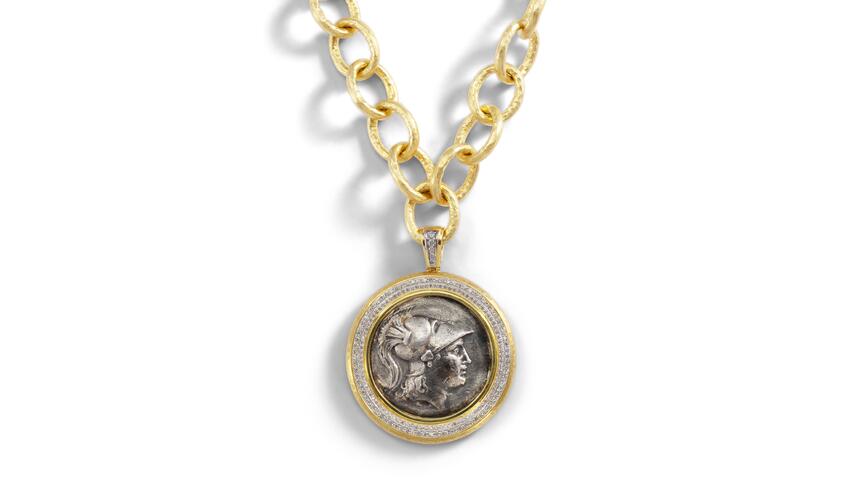 Jorge Adeler's “Gods & Heroes” enhancer featuring a one-of-a-kind coin set in 18-karat yellow gold with diamonds and rubies ($25,880) is one of the 18 pieces featured in this roundup of fine jewelry inspired by the ancient Greek aesthetic of "The Odyssey." Jorge Adeler Gods & Heroes coin pendant