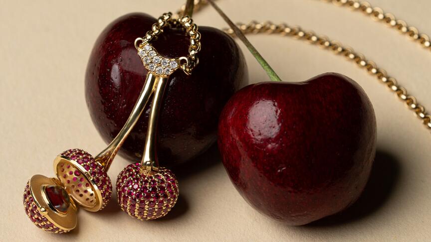 The cherry edition of the “Enchanted Garden” necklace features ruby pavé totaling 2.65 carats in 18-karat yellow gold and 0.06 carats of diamond accents. One of the articulated cherries opens to reveal a 0.75-carat cabochon garnet ($10,985). Monica Rich Kosann Enchanted Garden Cherry Necklace