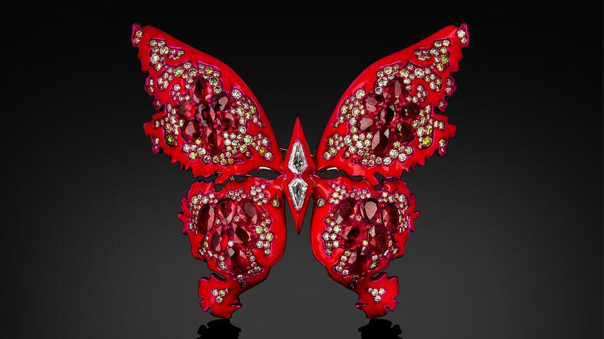 “The Soul of Flame II” brooch designed by Austy Lee is an 18-karat rose gold and red enamel butterfly set with unheated Mozambican rubies as well as fancy-color and white diamonds. It is the centerpiece of “Rubies,” a new exhibition on display at the Harvard Museum of Natural History. Harvard Rubies Exhibit The Soul of Flame II Brooch by Austy Lee
