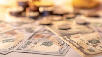 Stock image of paper money and coins 
