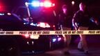 Stock image of crime scene with police cars and crime scene tape