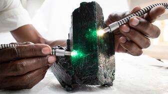“Even under the beam of a strong light that is necessary to illuminate a gemstone of this remarkable size, ‘Imboo’ reveals an intense, verdant green with golden warmth and a clarity that captivates the eye,” said Adrian Banks, Gemfields’ managing director of product and sales. (Photo courtesy of Gemfields) 11,685-carat Imboo emerald