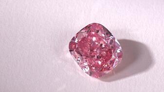 “The Glowing Rose,” weighing 10.08 carats, is a type IIa, cushion-cut, fancy vivid pink diamond that was mined in Angola in 2023. Sothebys the glowing rose pink diamond