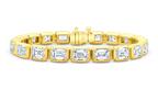 Diamond huggies, studs, tennis necklaces, bangles, and charms are among the top diamond jewelry trends forecasted for the holiday season. Pictured is a Rahaminov Diamonds bracelet with emerald-cut diamonds totaling 20.18 carats in 18-karat yellow gold ($115,960). Rahaminov Diamonds Emerald-Cut Diamond Bracelet