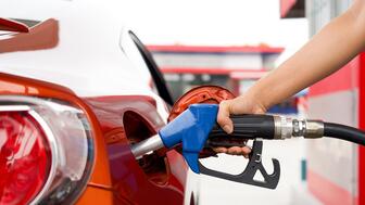 Hand holding a gas pump