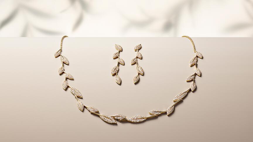 Brilliant Earth Jane Goodall olive branch necklace and earrings